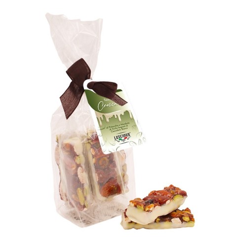 Luscioux Morceaux de croquant dans un sac avec nœud de pistache et amande sicilienne trempée dans du chocolat blanc